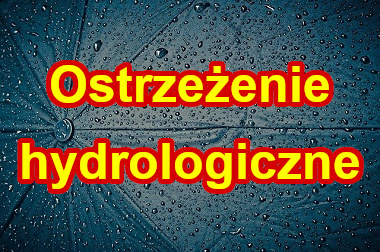 Napis ostrzeżenie hydrologiczne na tle parasola.